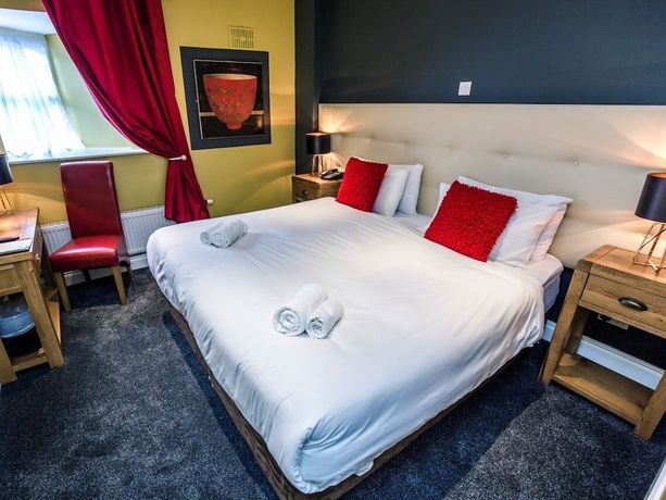 Imagen de la habitación del Hotel Mc Kevitts Village. Foto 18