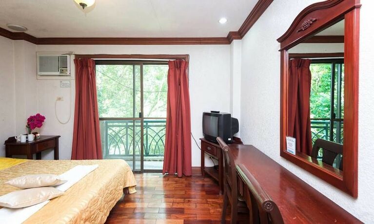 Imagen de la habitación del Hotel Mc Mountain Home Apartelle. Foto 19