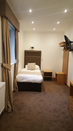 Imagen de la habitación del Hotel Mclays Guest House. Foto 5