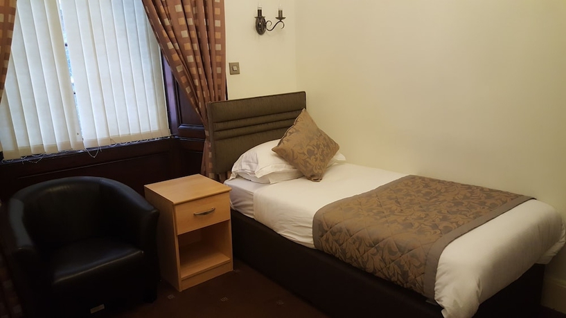 Imagen de la habitación del Hotel Mclays Guest House. Foto 7