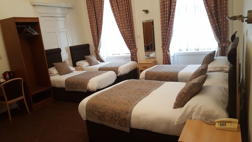 Imagen de la habitación del Hotel Mclays Guest House. Foto 10