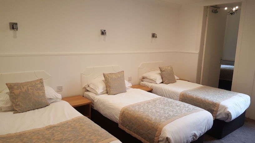 Imagen de la habitación del Hotel Mclays Guest House. Foto 11