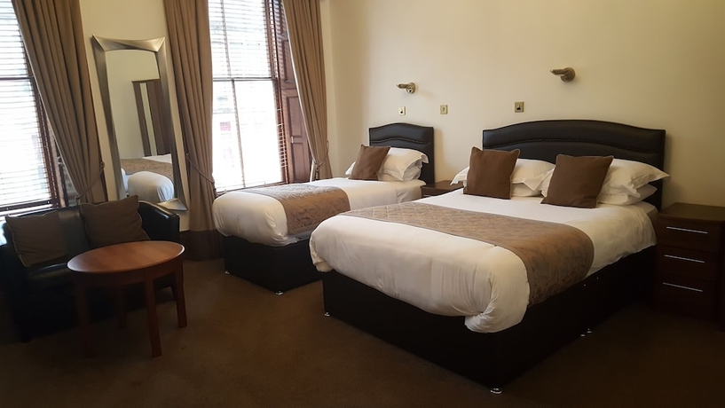 Imagen de la habitación del Hotel Mclays Guest House. Foto 13