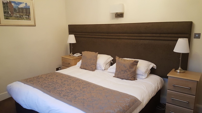 Imagen de la habitación del Hotel Mclays Guest House. Foto 15