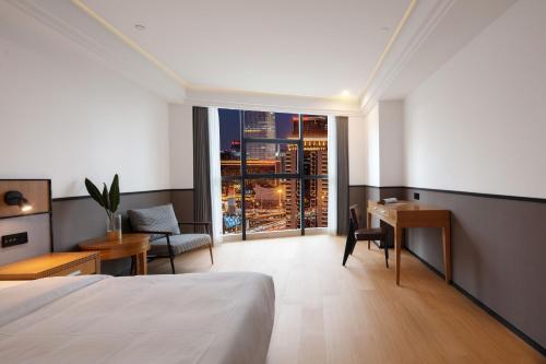 Imagen de la habitación del Hotel Mcsrh-Chongqing Guanyinqiao. Foto 19