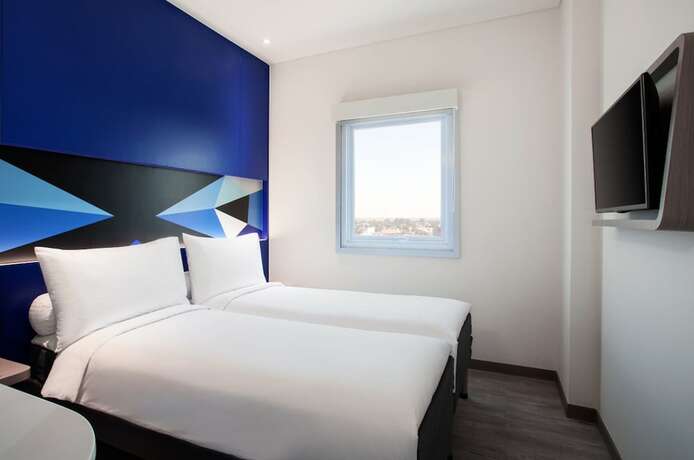 Imagen de la habitación del Hotel Md7 Cirebon. Foto 10