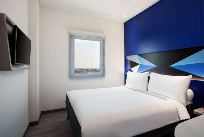 Imagen de la habitación del Hotel Md7 Cirebon. Foto 12