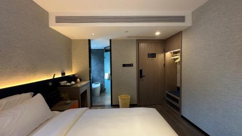 Imagen de la habitación del Hotel Mehood Ankang Ziyang. Foto 14