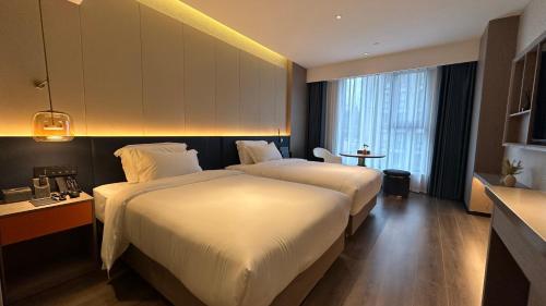 Imagen de la habitación del Hotel Mehood Ankang Ziyang. Foto 19