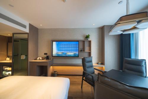 Imagen de la habitación del Hotel Mehood Ankang Ziyang. Foto 20