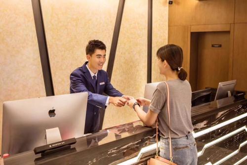 Imagen general del Hotel Mehood Dalian Hi-tech Wanda Plaza Xinghai. Foto 9
