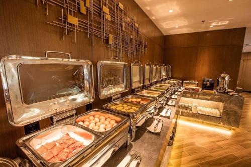 Imagen general del Hotel Mehood Dalian Hi-tech Wanda Plaza Xinghai. Foto 11