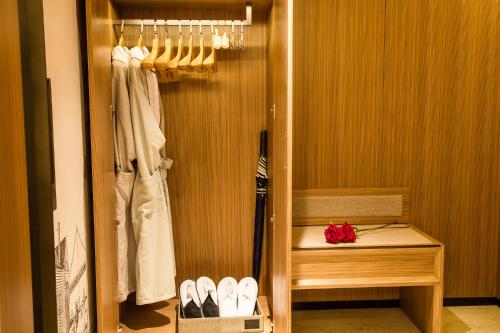 Imagen de la habitación del Hotel Mehood Dalian Hi-tech Wanda Plaza Xinghai. Foto 20
