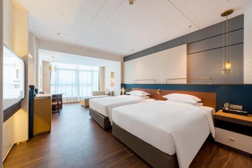 Imagen de la habitación del Hotel Mehood Elegant - Guangzhou Baiyun Airport Huadu Cultural Tourism City Branch. Foto 20