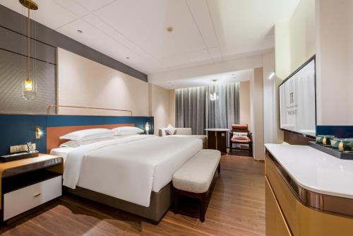 Imagen de la habitación del Hotel Mehood Elegant Guangzhou Baiyun Airport Huadu Cultural Tourism City. Foto 17