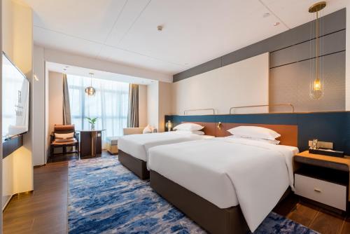 Imagen de la habitación del Hotel Mehood Elegant Guangzhou Baiyun Airport Huadu Cultural Tourism City. Foto 18