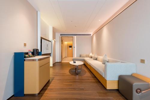 Imagen de la habitación del Hotel Mehood Elegant Guangzhou Baiyun Airport Huadu Cultural Tourism City. Foto 19