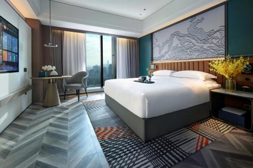 Imagen de la habitación del Hotel Mehood Guangzhou Pazhou Convention and Exhibition Center. Foto 13