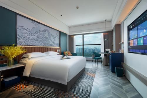 Imagen de la habitación del Hotel Mehood Guangzhou Pazhou Convention and Exhibition Center. Foto 14