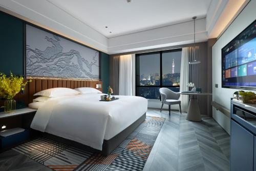 Imagen de la habitación del Hotel Mehood Guangzhou Pazhou Convention and Exhibition Center. Foto 15