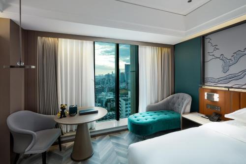 Imagen de la habitación del Hotel Mehood Guangzhou Pazhou Convention and Exhibition Center. Foto 16