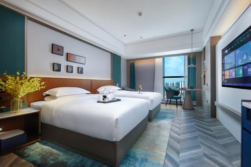 Imagen de la habitación del Hotel Mehood Guangzhou Pazhou Convention and Exhibition Center. Foto 17