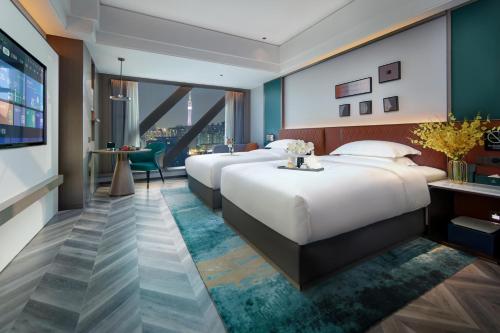 Imagen de la habitación del Hotel Mehood Guangzhou Pazhou Convention and Exhibition Center. Foto 18