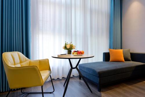 Imagen de la habitación del Hotel Mehood Hanzhong Central Plaza. Foto 15