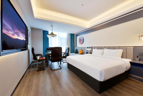 Imagen de la habitación del Hotel Mehood Hanzhong Central Plaza. Foto 17