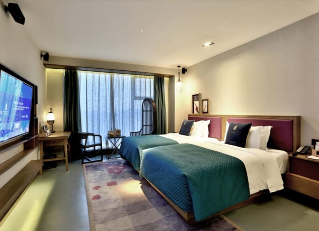 Imagen de la habitación del Hotel Mehood Lestie Hotel Wuxi. Foto 10