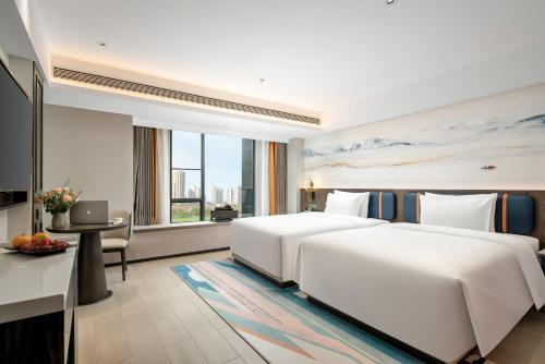 Imagen de la habitación del Hotel Mehood Lestie Maoming High-speed Railway. Foto 18