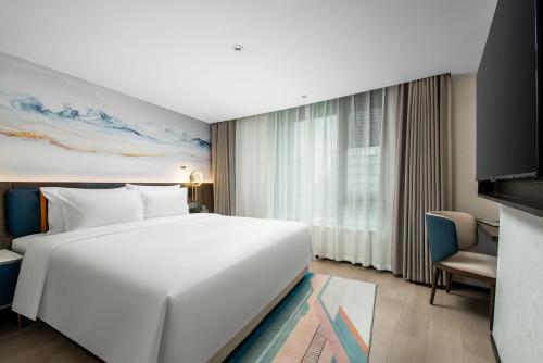 Imagen de la habitación del Hotel Mehood Lestie Maoming High-speed Railway. Foto 19