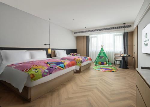 Imagen de la habitación del Hotel Mehood Lestie Panyu Wanbo Yuangang Metro Station Branch - Free Shuttle Bus to Canton Fair Comp. Foto 14