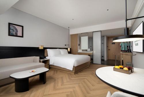 Imagen de la habitación del Hotel Mehood Lestie Panyu Wanbo Yuangang Metro Station Branch - Free Shuttle Bus to Canton Fair Comp. Foto 15