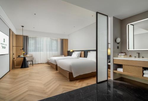 Imagen de la habitación del Hotel Mehood Lestie Panyu Wanbo Yuangang Metro Station Branch - Free Shuttle Bus to Canton Fair Comp. Foto 17