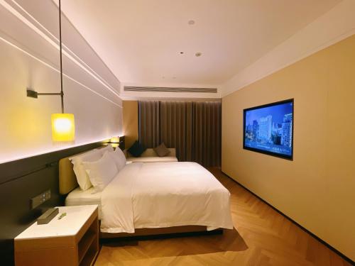 Imagen de la habitación del Hotel Mehood Lestie Panyu Wanbo Yuangang Metro Station Branch - Free Shuttle Bus to Canton Fair Comp. Foto 20