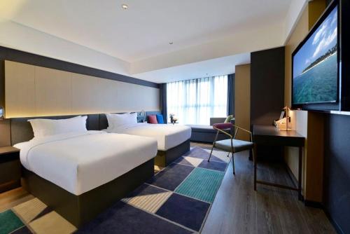 Imagen general del Hotel Mehood Lestie, Qujiang Dayan Pagoda Datang Everlasting City Jinhui Plaza. Foto 5