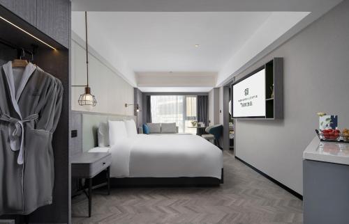 Imagen de la habitación del Hotel Mehood Lestie, Taizhou Pozi Street. Foto 14