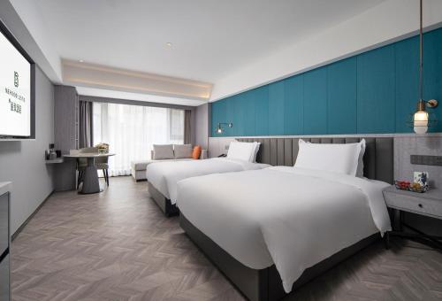 Imagen de la habitación del Hotel Mehood Lestie, Taizhou Pozi Street. Foto 17