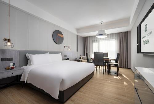 Imagen de la habitación del Hotel Mehood Lestie, Taizhou Pozi Street. Foto 20