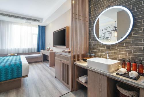 Imagen general del Hotel Mehood Lestie, Tianjin Changhong Park. Foto 7