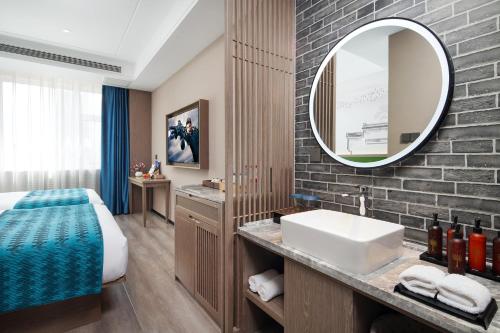 Imagen de la habitación del Hotel Mehood Lestie, Tianjin Changhong Park. Foto 16