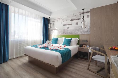 Imagen de la habitación del Hotel Mehood Lestie, Tianjin Changhong Park. Foto 18