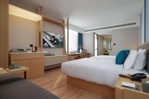 Imagen general del Hotel Mehood Lestie, Tianjin Meijiang Convention and Exhibition Center Flagship Store. Foto 3