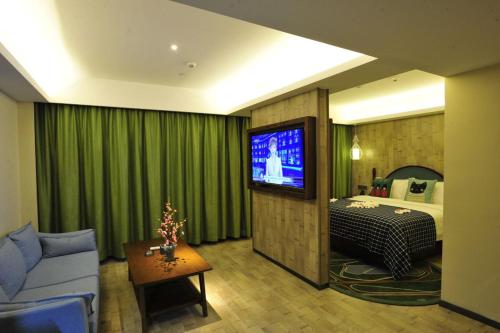Imagen de la habitación del Hotel Mehood Theater, Jinan High -tech Zone Wanda Plaza. Foto 16