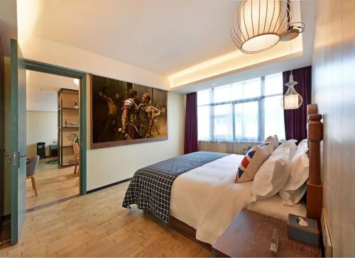 Imagen de la habitación del Hotel Mehood Theater, Jinan High -tech Zone Wanda Plaza. Foto 20