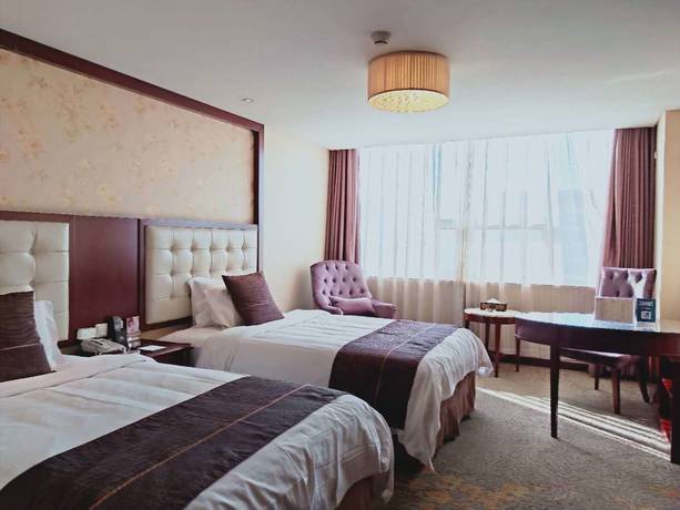 Imagen de la habitación del Hotel Mehood Tianjin. Foto 2