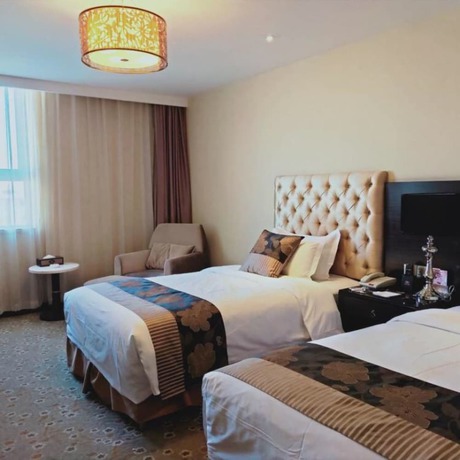 Imagen de la habitación del Hotel Mehood Tianjin. Foto 10