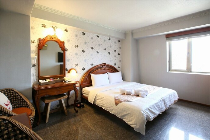 Imagen de la habitación del Hotel Mei Jia Mei. Foto 12