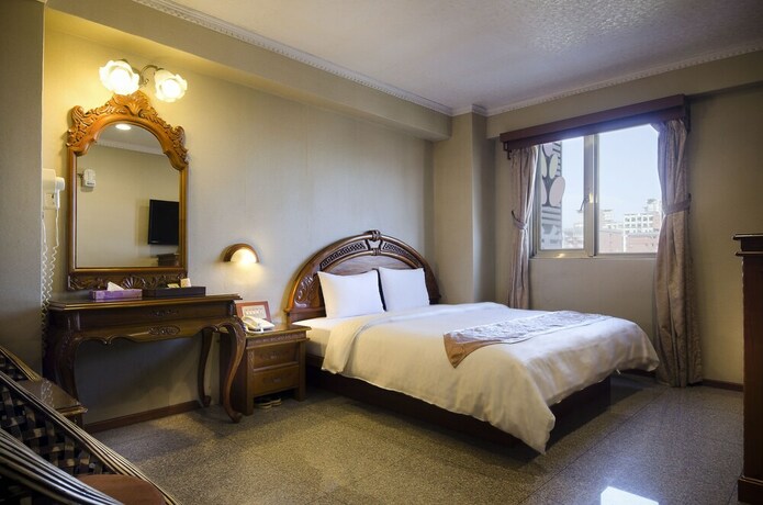Imagen de la habitación del Hotel Mei Jia Mei. Foto 13